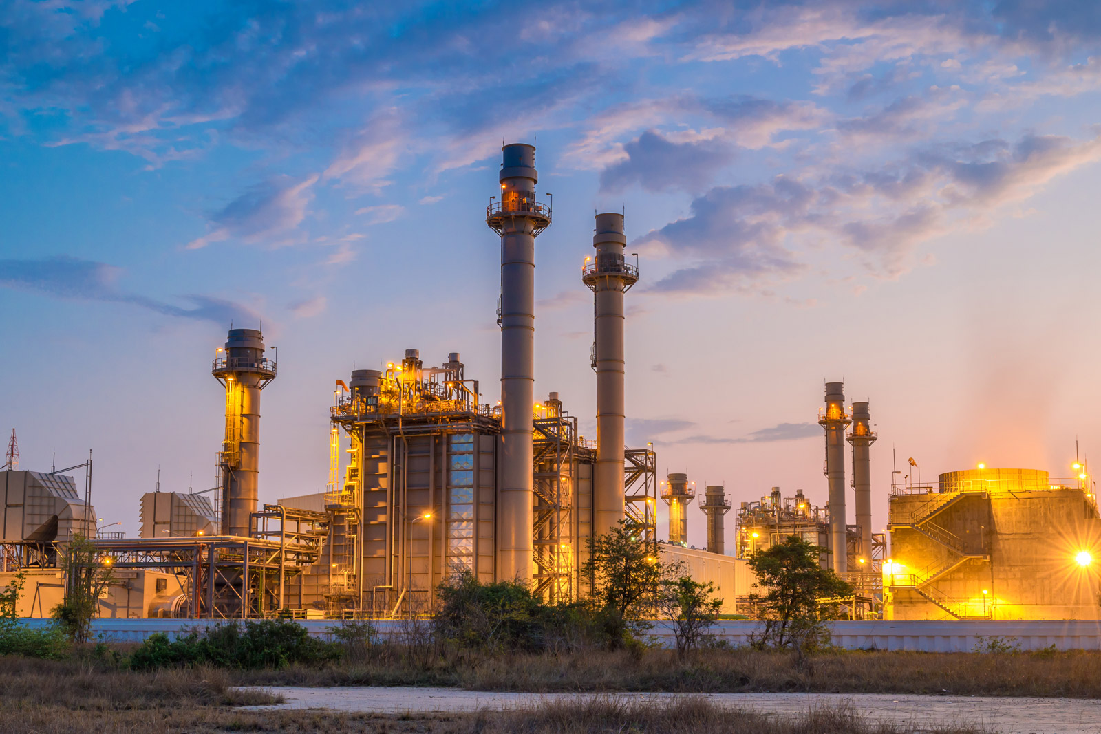 energy and utilities power plant at dusk